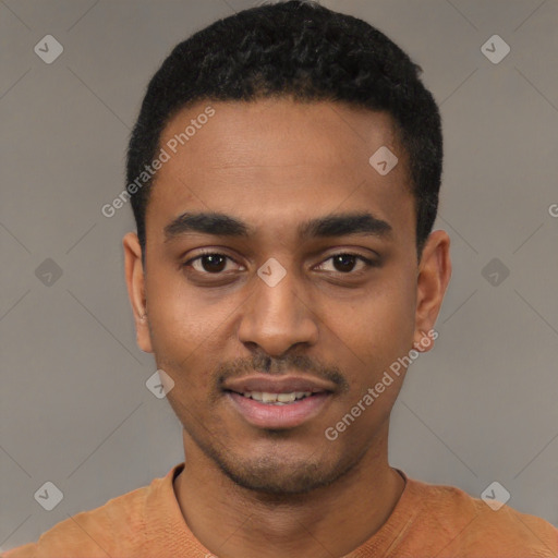 Joyful black young-adult male with short  black hair and brown eyes