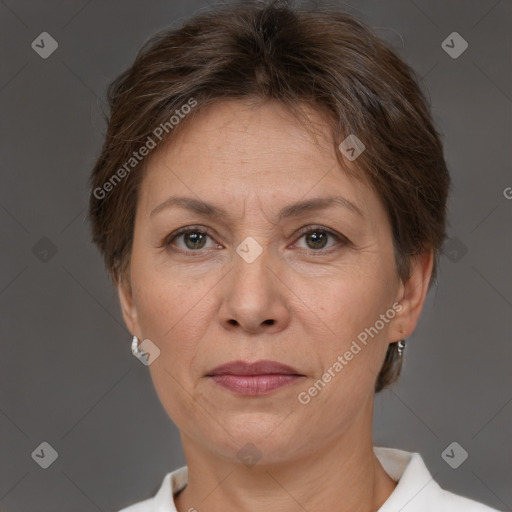 Joyful white adult female with short  brown hair and brown eyes