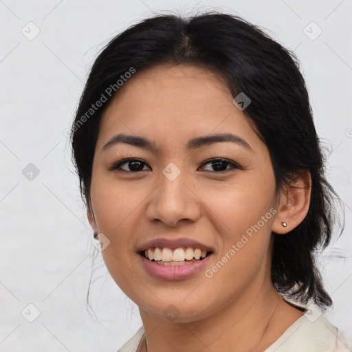 Joyful asian young-adult female with medium  brown hair and brown eyes