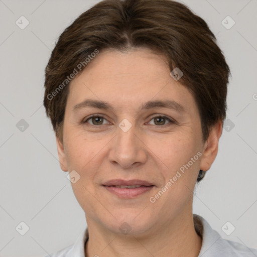 Joyful white adult female with short  brown hair and brown eyes