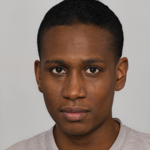 Neutral black young-adult male with short  black hair and brown eyes
