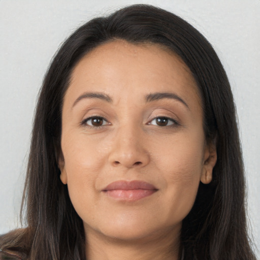 Joyful asian young-adult female with long  brown hair and brown eyes