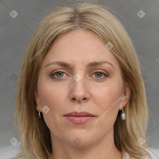 Joyful white adult female with medium  brown hair and grey eyes