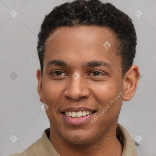 Joyful latino young-adult male with short  brown hair and brown eyes