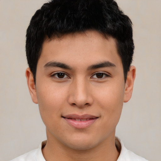 Joyful asian young-adult male with short  brown hair and brown eyes