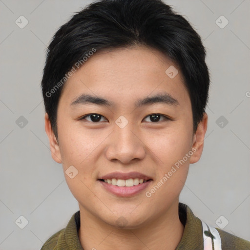 Joyful asian young-adult male with short  brown hair and brown eyes