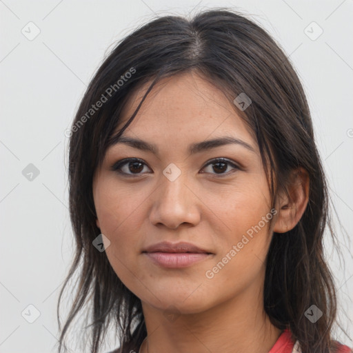 Joyful asian young-adult female with long  brown hair and brown eyes