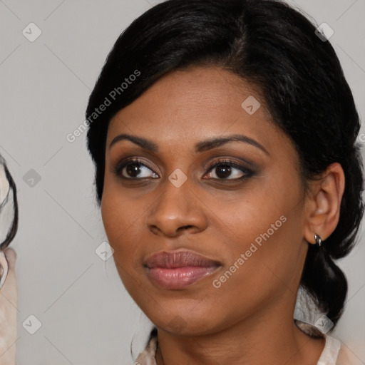 Joyful latino young-adult female with medium  brown hair and brown eyes