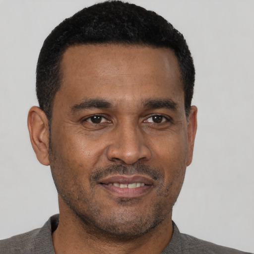 Neutral black young-adult male with short  black hair and brown eyes