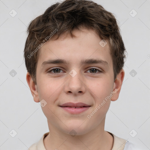 Joyful white child male with short  brown hair and brown eyes