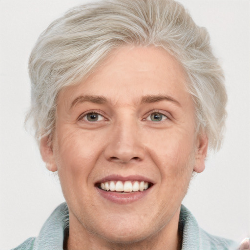 Joyful white adult male with short  blond hair and blue eyes