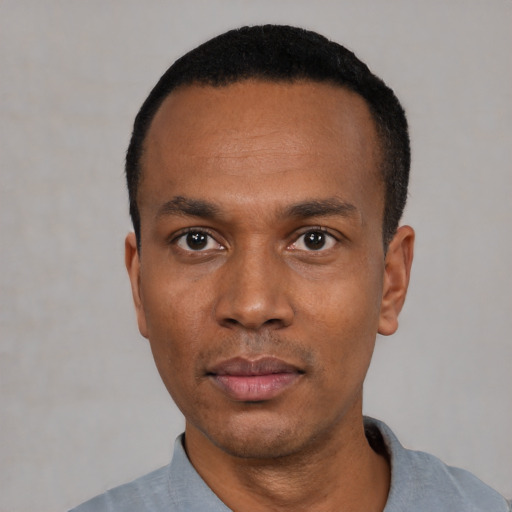 Neutral black young-adult male with short  black hair and brown eyes
