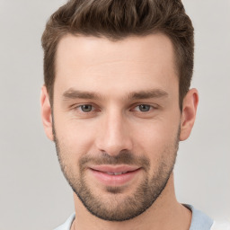 Joyful white young-adult male with short  brown hair and brown eyes