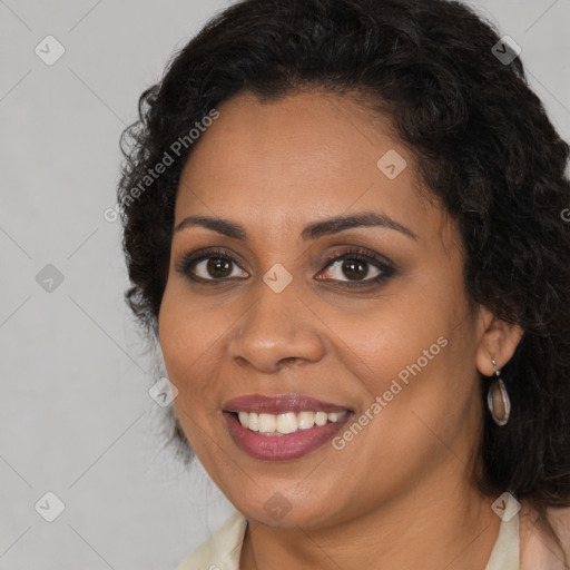 Joyful latino young-adult female with long  brown hair and brown eyes