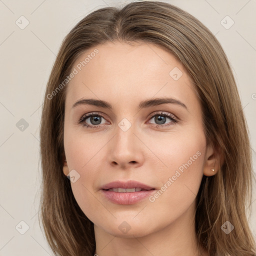 Neutral white young-adult female with long  brown hair and brown eyes