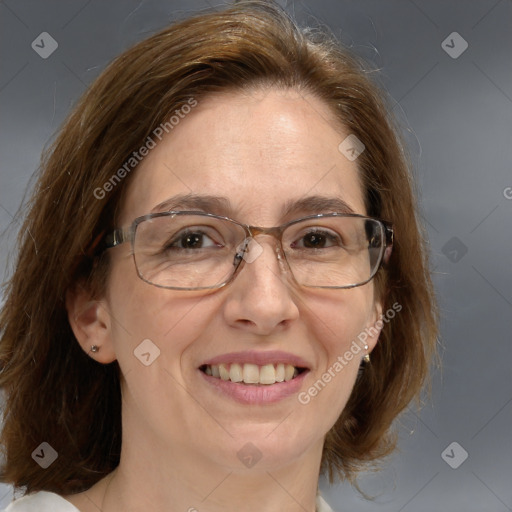 Joyful white adult female with medium  brown hair and blue eyes