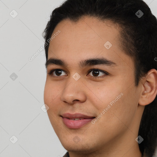 Joyful latino young-adult male with short  brown hair and brown eyes