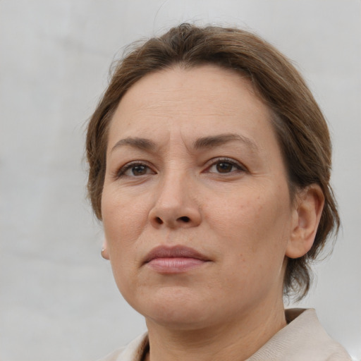 Neutral white adult female with short  brown hair and brown eyes