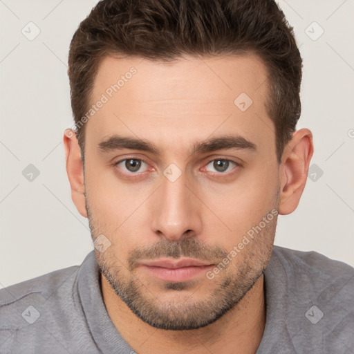 Neutral white young-adult male with short  brown hair and brown eyes