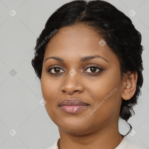 Joyful black young-adult female with short  black hair and brown eyes