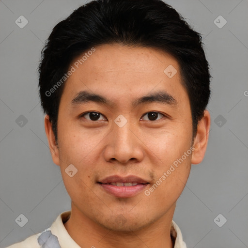 Joyful asian young-adult male with short  brown hair and brown eyes