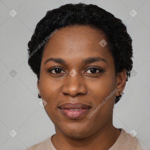 Joyful black young-adult female with short  black hair and brown eyes