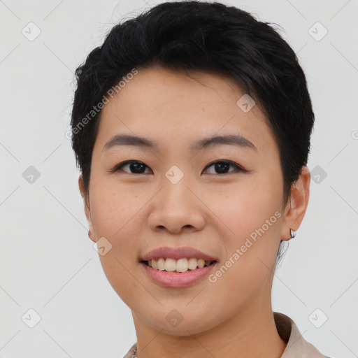 Joyful asian young-adult female with short  black hair and brown eyes