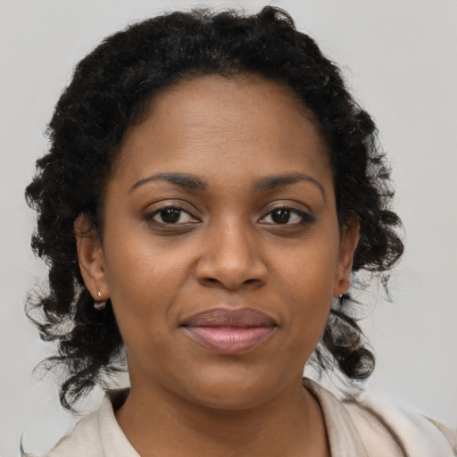 Joyful black young-adult female with medium  brown hair and brown eyes