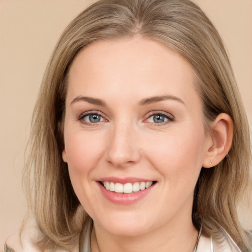 Joyful white young-adult female with medium  brown hair and blue eyes