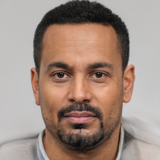 Neutral black adult male with short  black hair and brown eyes