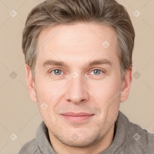 Joyful white adult male with short  brown hair and grey eyes