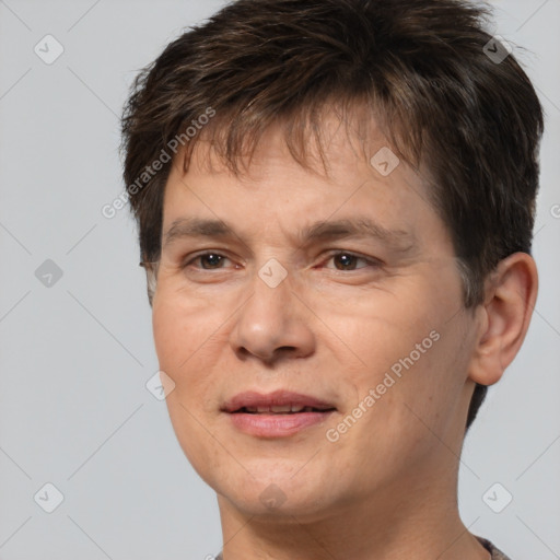 Joyful white adult male with short  brown hair and brown eyes