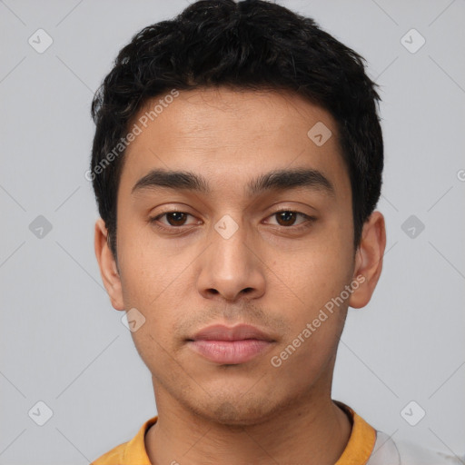 Neutral latino young-adult male with short  black hair and brown eyes