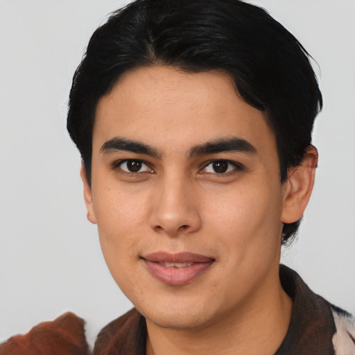 Joyful asian young-adult male with short  black hair and brown eyes