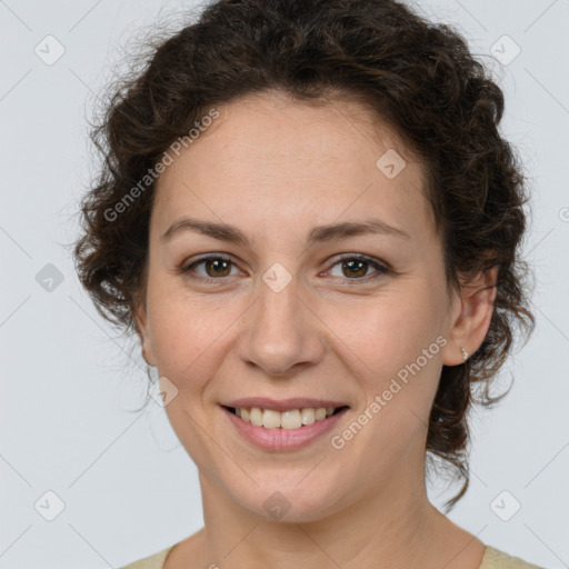 Joyful white young-adult female with medium  brown hair and green eyes