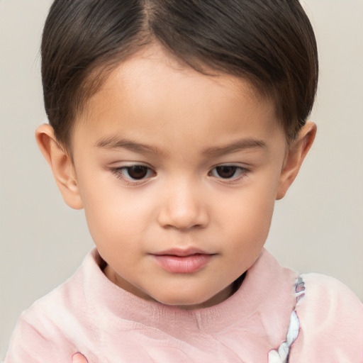 Joyful white child male with short  brown hair and brown eyes