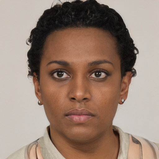 Neutral black young-adult female with short  black hair and brown eyes