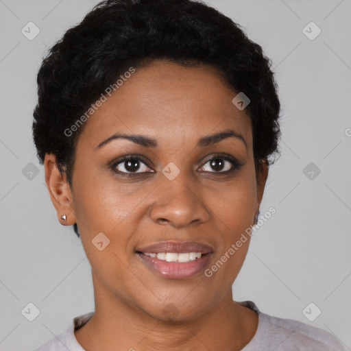 Joyful black young-adult female with short  black hair and brown eyes