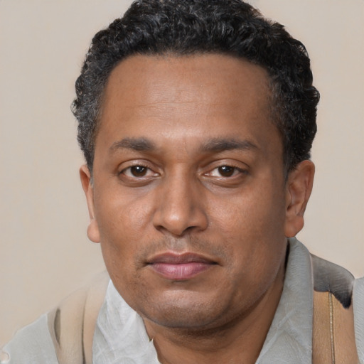 Neutral black adult male with short  black hair and brown eyes