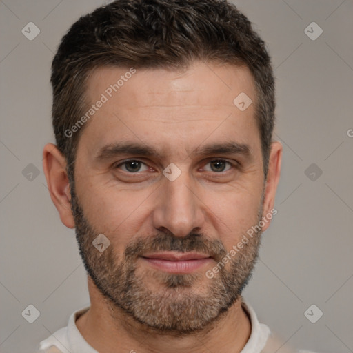 Joyful white adult male with short  brown hair and brown eyes