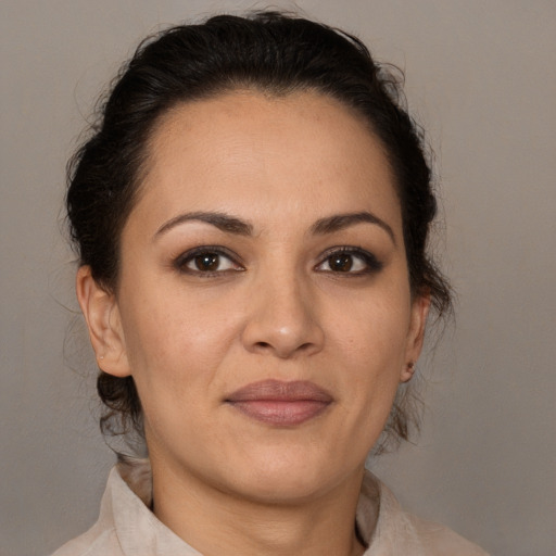 Joyful white adult female with medium  brown hair and brown eyes