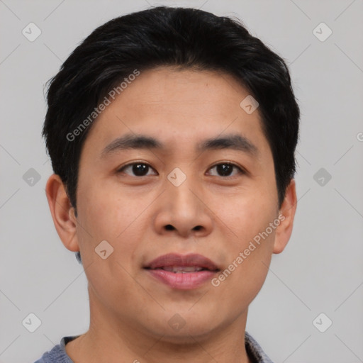 Joyful asian young-adult male with short  black hair and brown eyes