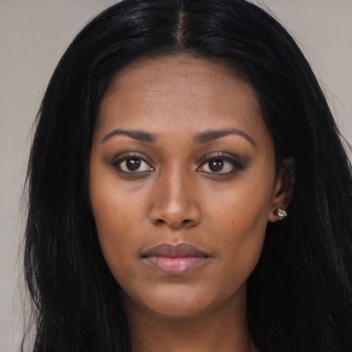 Joyful asian young-adult female with long  black hair and brown eyes