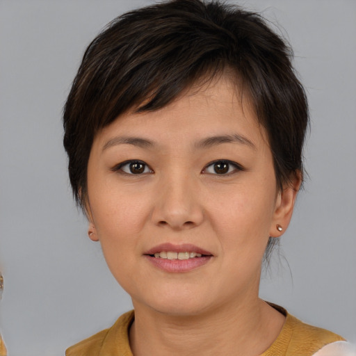 Joyful white young-adult female with medium  brown hair and brown eyes