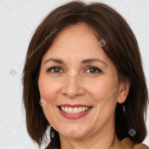 Joyful white adult female with medium  brown hair and brown eyes