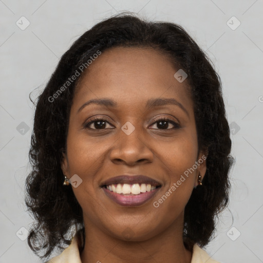 Joyful black young-adult female with medium  brown hair and brown eyes