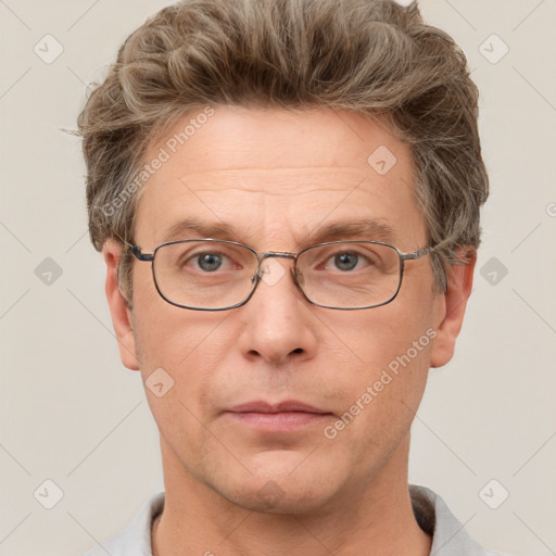 Joyful white adult male with short  brown hair and grey eyes