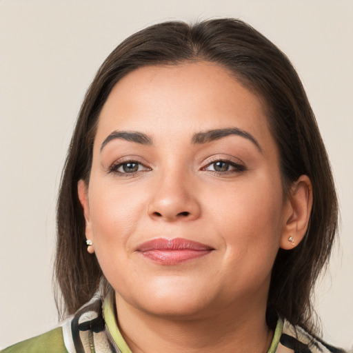 Joyful white young-adult female with medium  brown hair and brown eyes