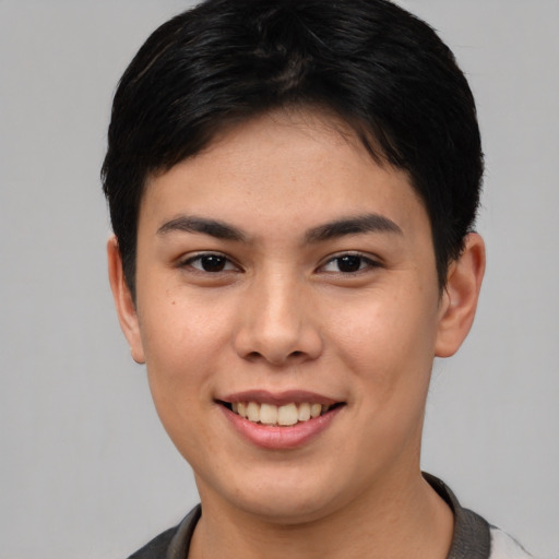 Joyful asian young-adult female with short  brown hair and brown eyes