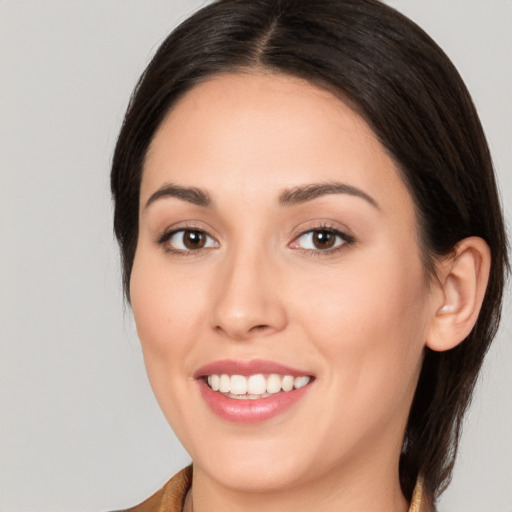 Joyful white young-adult female with medium  brown hair and brown eyes